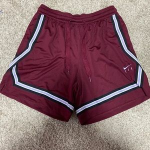 Women’s Nike basketball shorts ~ size medium ( color is like a redish purple )